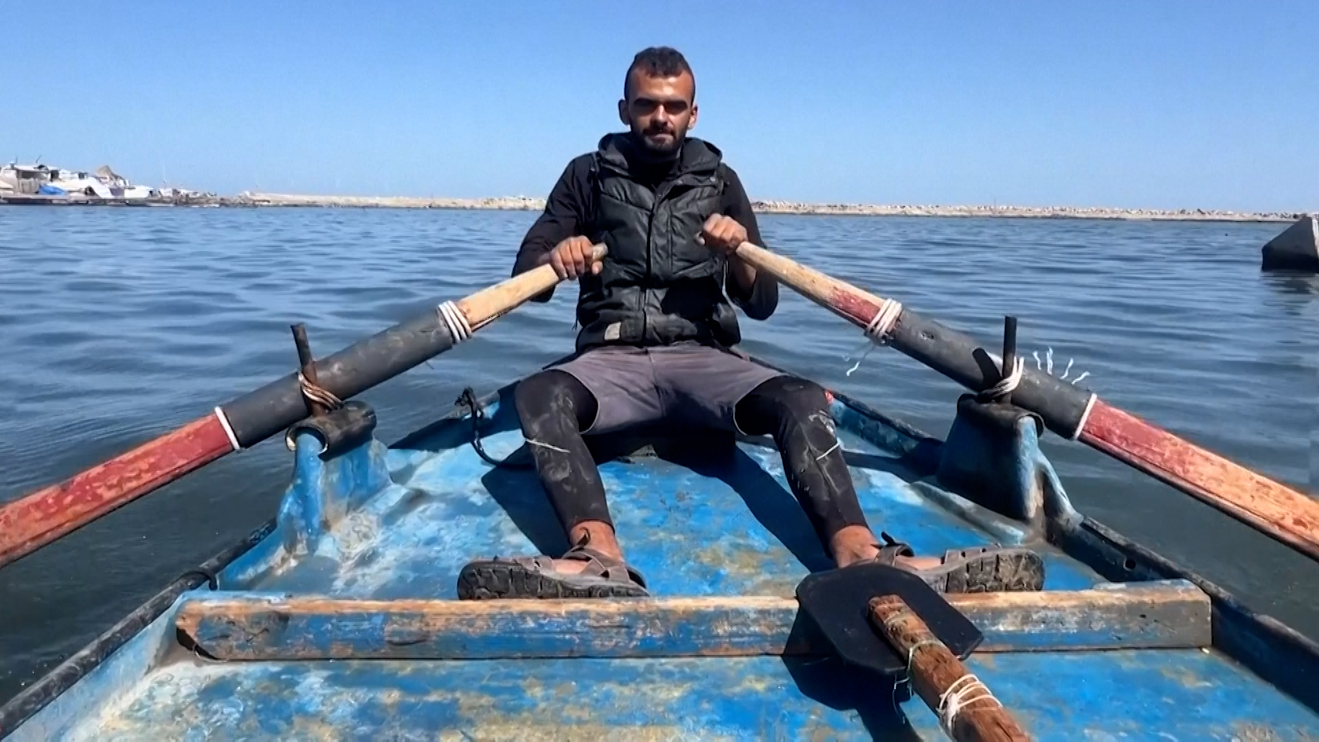 Gaza fishermen use makeshift dinghies made from old doorframes at sea