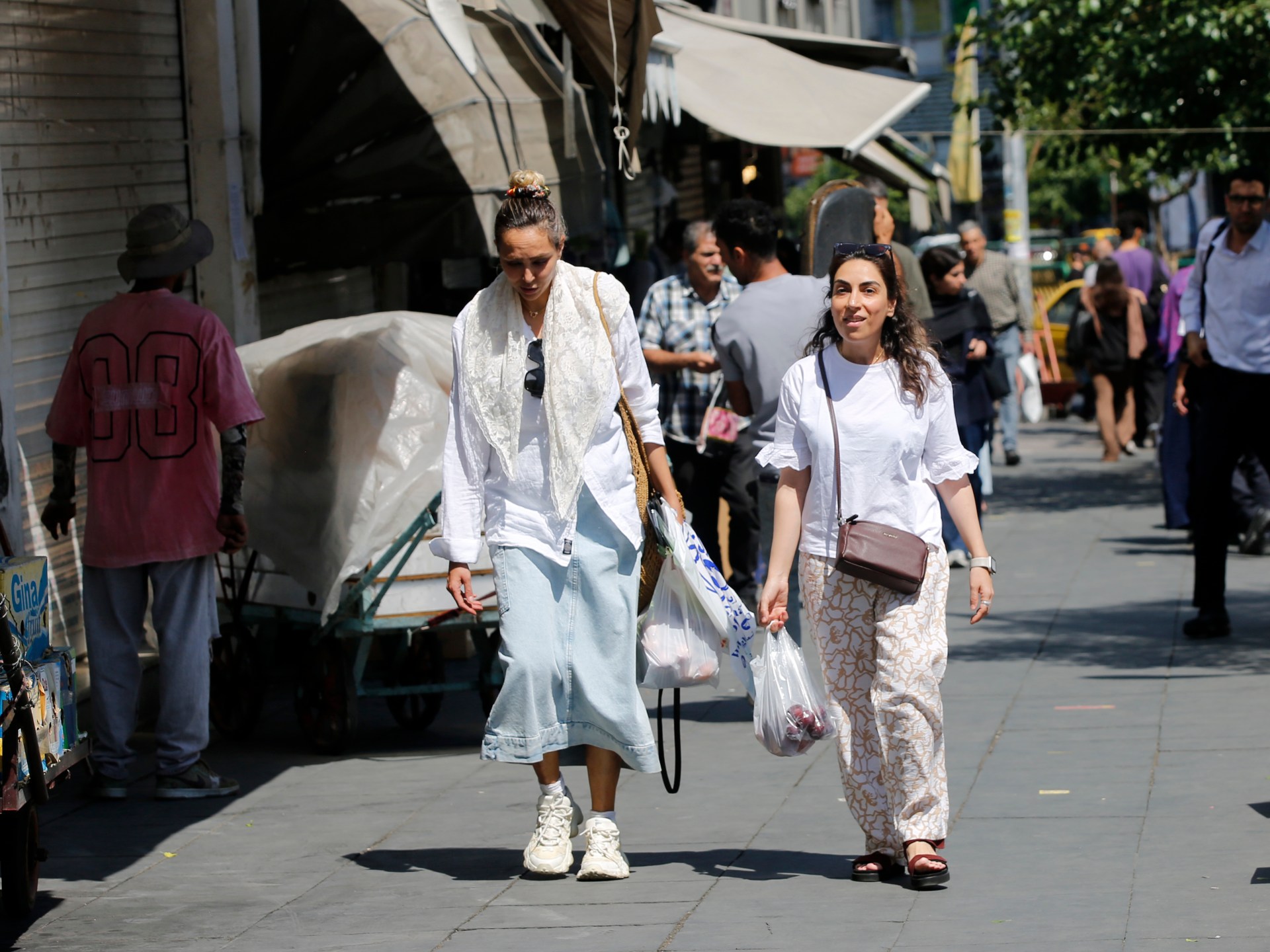 Uncertainty grips Iran as people adapt to life under US sanctions